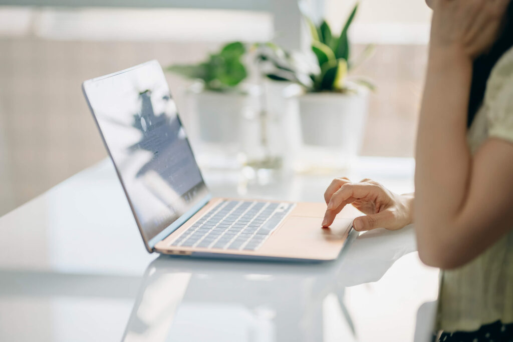 Woman typing on a computer